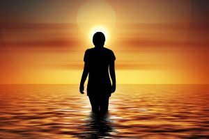 This image has an empty alt attribute; its file name is Sun-Ocean-Woman-300x200.jpg